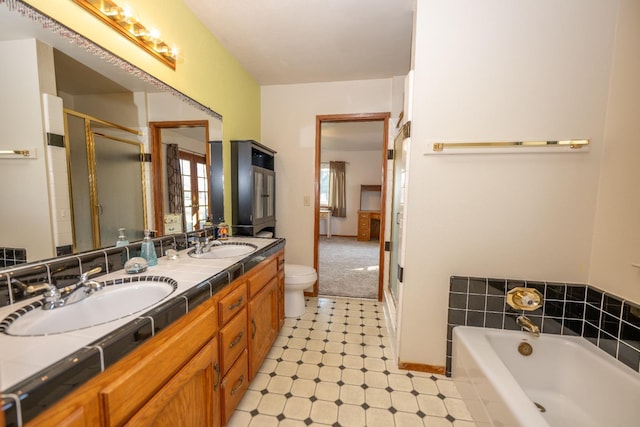 8510 E Nees Ave, Clovis, CA 93619 - bathroom featuring a shower stall, double vanity, a bath, and tile patterned floors