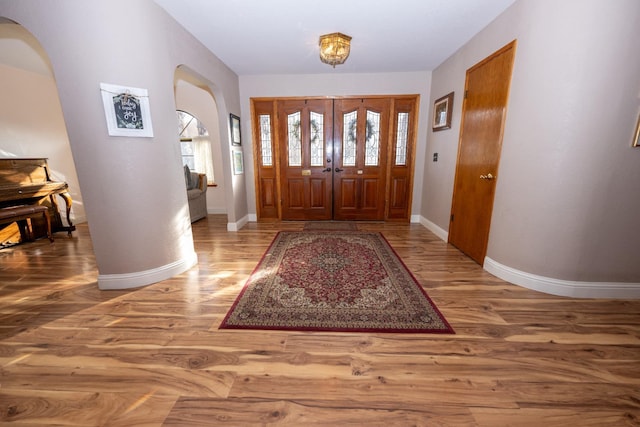 8510 E Nees Ave, Clovis, CA 93619 - foyer with arched walkways, wood finished floors, and baseboards