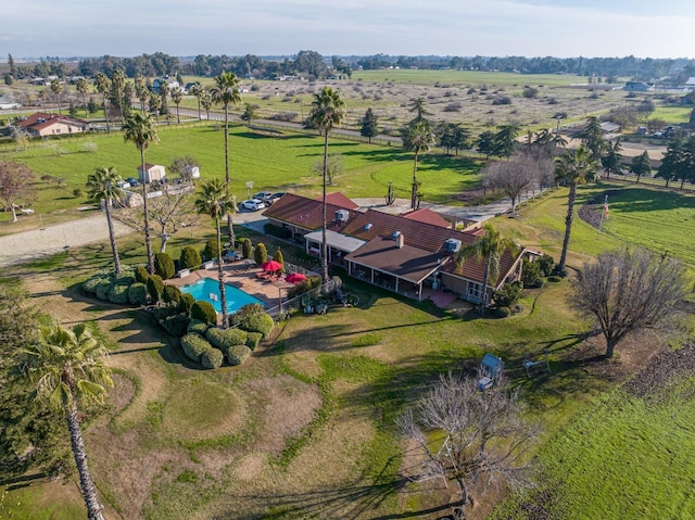 birds eye view of property with a rural view