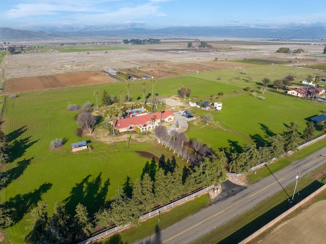 birds eye view of property with a rural view