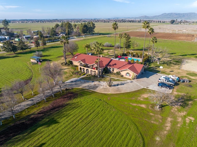 bird's eye view with a mountain view and a rural view