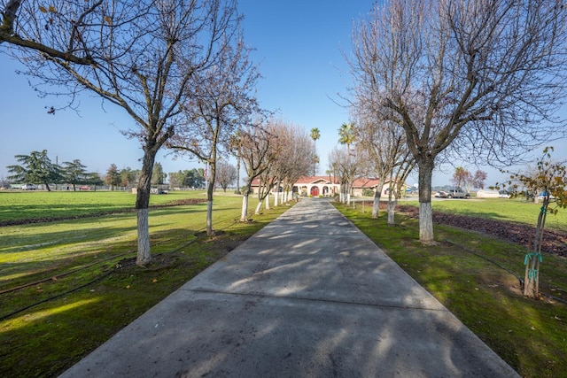 8510 E Nees Ave, Clovis, CA 93619 - view of community featuring a lawn and concrete driveway