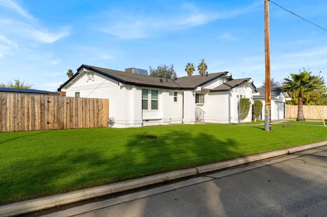 single story home with a front yard