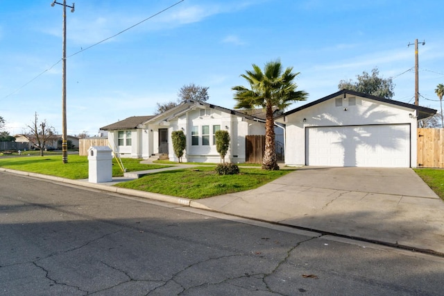 ranch-style house with a garage and a front lawn