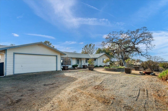 ranch-style home featuring a garage