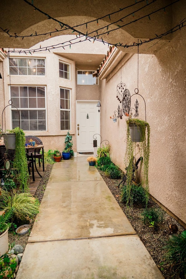 doorway to property featuring a patio area