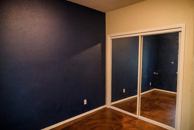 unfurnished bedroom with a closet