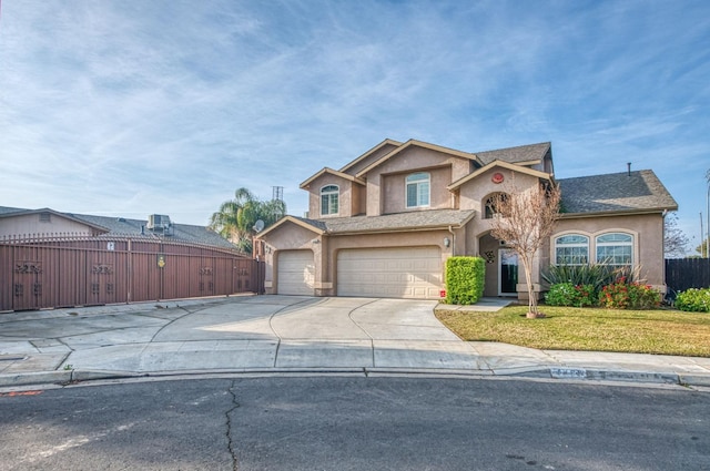 view of front of home with a garage and a front lawn