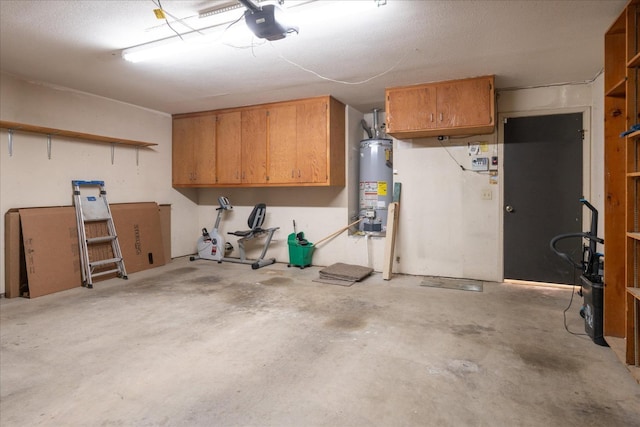 garage featuring water heater and a garage door opener