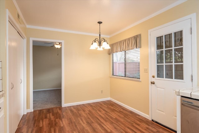 unfurnished dining area with baseboards, ornamental molding, dark wood finished floors, and ceiling fan with notable chandelier