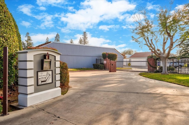 exterior space with a gate and driveway