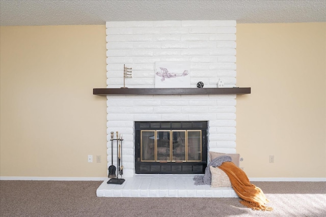 interior details featuring a textured ceiling, carpet, a fireplace, and baseboards