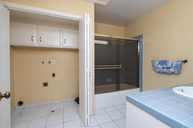 full bathroom with tile patterned flooring, combined bath / shower with glass door, and vanity