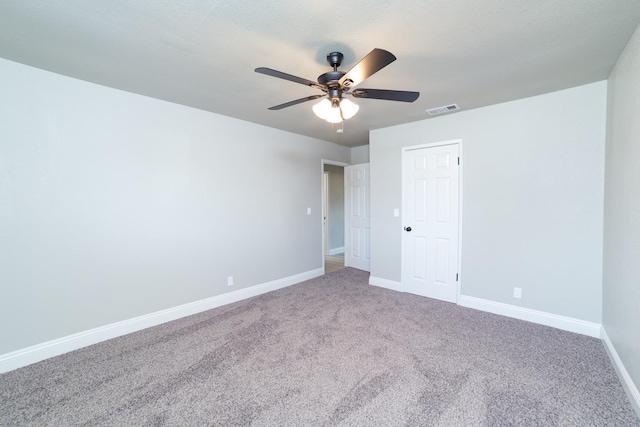 unfurnished bedroom featuring ceiling fan, carpet floors, and a closet