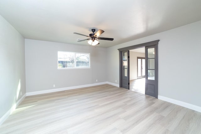 spare room featuring light hardwood / wood-style floors and ceiling fan