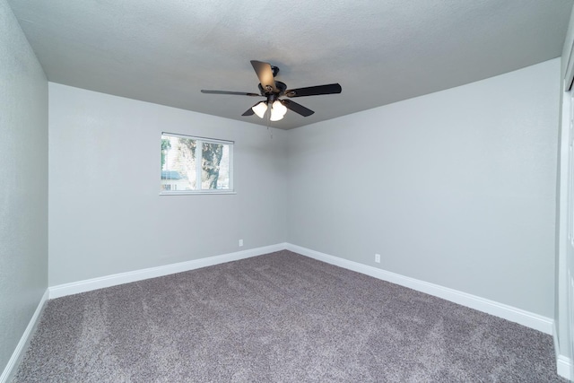 carpeted spare room with ceiling fan and a textured ceiling