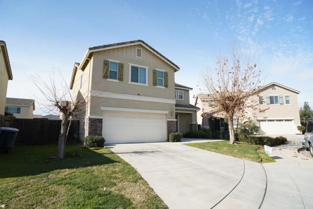 view of front property with a front lawn and a garage