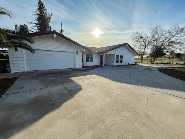 single story home featuring a garage