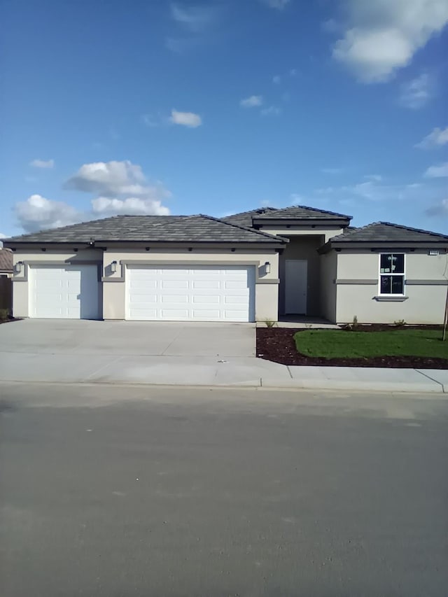 prairie-style house featuring a garage