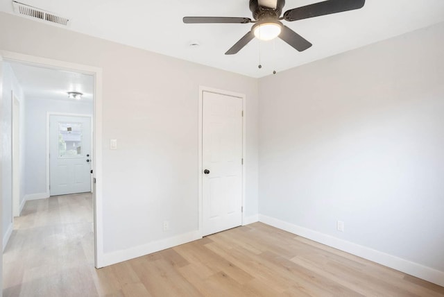 unfurnished room with ceiling fan and light hardwood / wood-style flooring