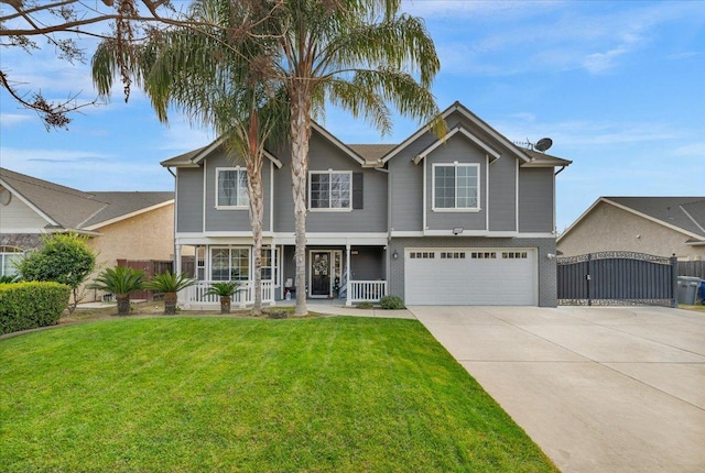 view of front of house with a porch, a garage, and a front lawn