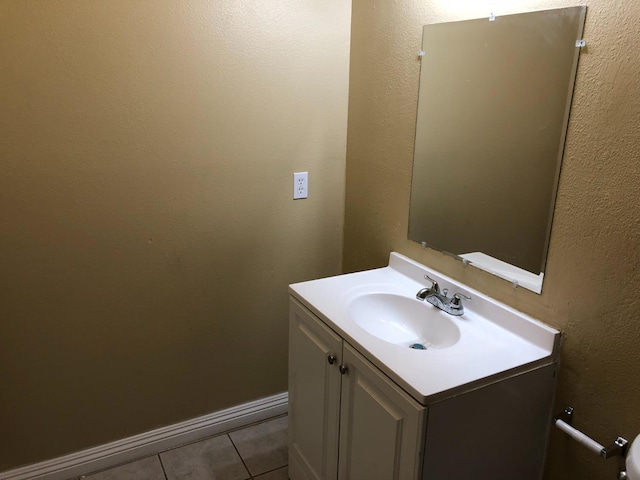 bathroom featuring tile patterned flooring and vanity