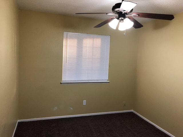 spare room with carpet flooring and ceiling fan