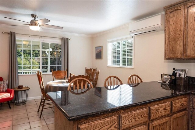 kitchen with ceiling fan, light tile patterned floors, dark stone counters, and a wall mounted AC