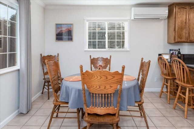 dining area with a wall mounted air conditioner, light tile patterned flooring, and crown molding