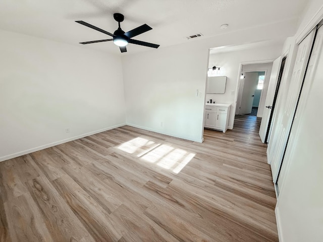 interior space with ceiling fan and light wood-type flooring