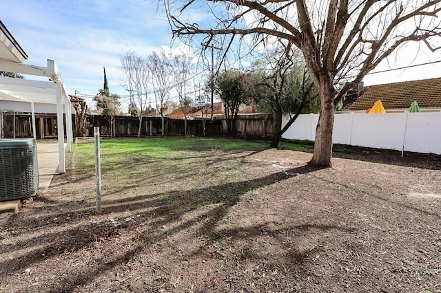 view of yard with central AC