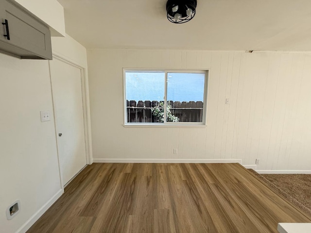 unfurnished room featuring dark wood-type flooring