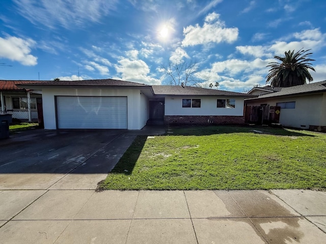 single story home with a front lawn and a garage