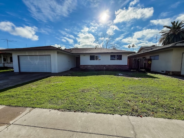 ranch-style home with a front lawn and a garage