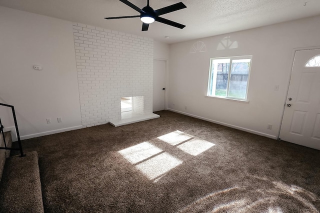 interior space featuring ceiling fan and a textured ceiling