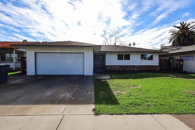 single story home featuring a front yard and a garage