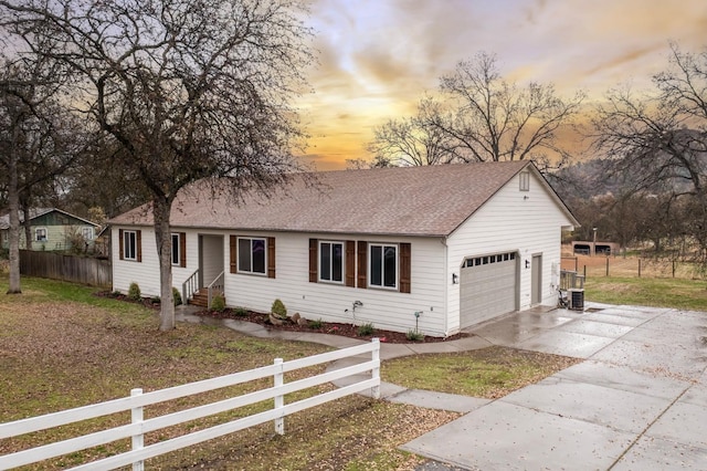 ranch-style house featuring a garage