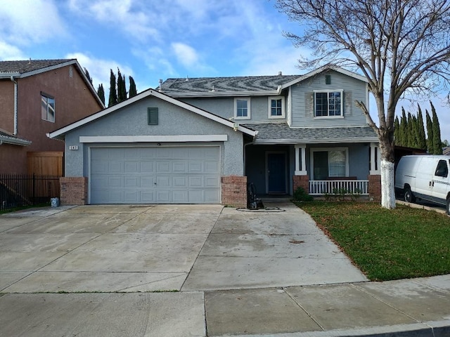 view of front of house featuring covered porch and a garage