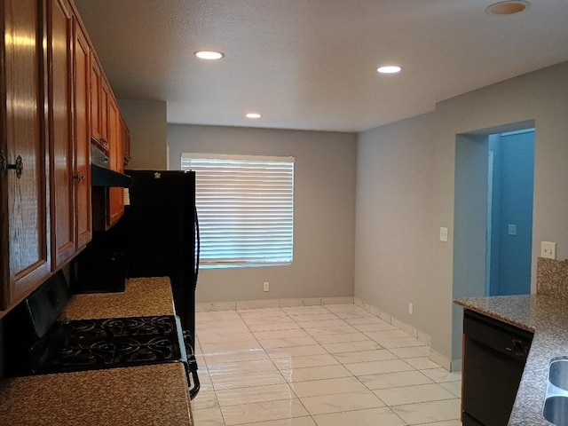 kitchen with light tile patterned floors and black appliances