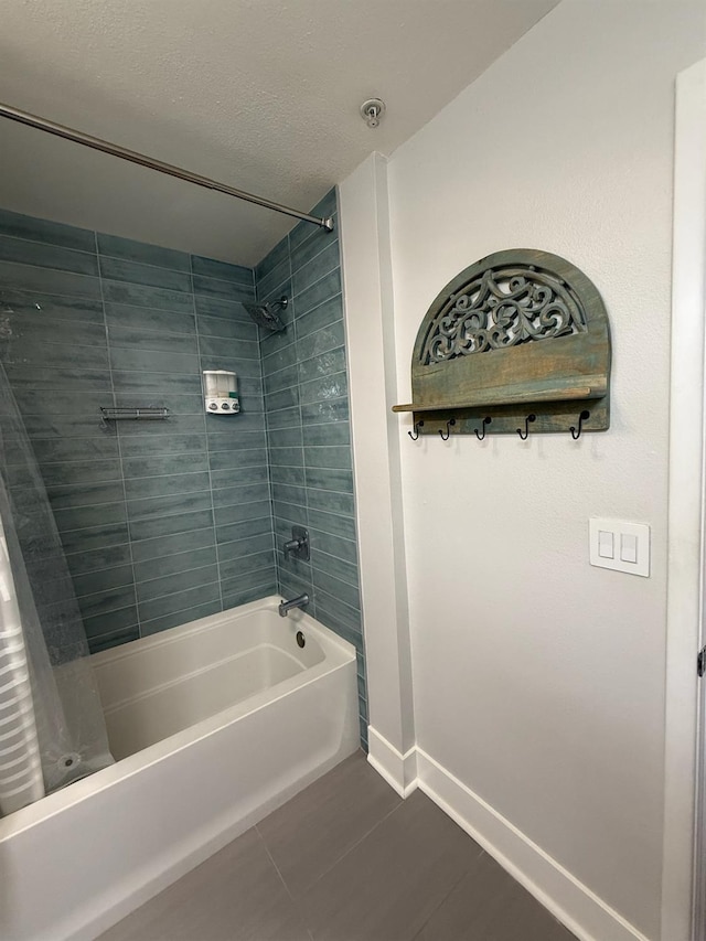 bathroom with a textured ceiling and shower / bath combo with shower curtain