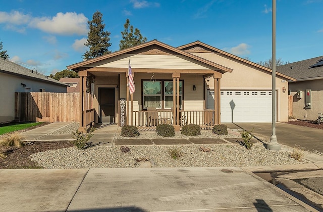 view of front of home featuring covered porch and a garage