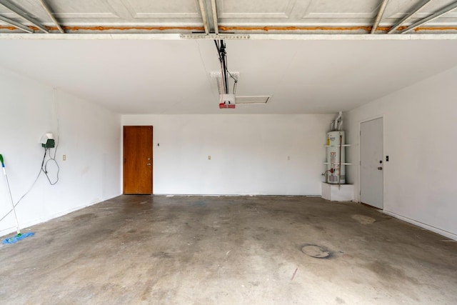 garage featuring water heater and a garage door opener