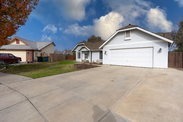 ranch-style home featuring a front lawn and a garage