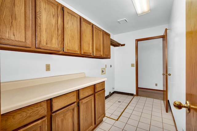 kitchen with light tile patterned flooring