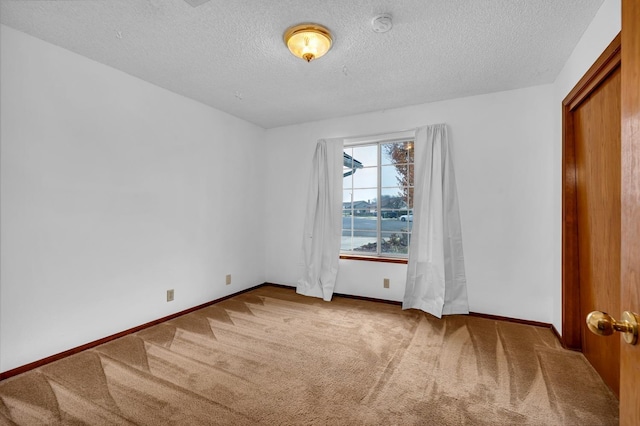 unfurnished bedroom featuring carpet and a textured ceiling