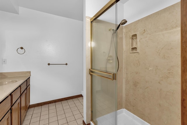 bathroom featuring tile patterned floors, vanity, toilet, and a shower with shower door