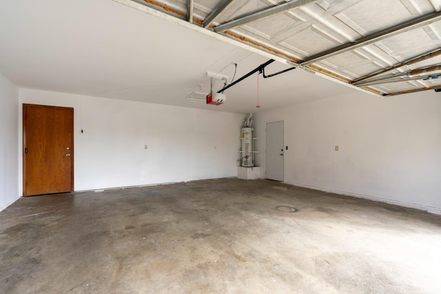 garage featuring a garage door opener and water heater