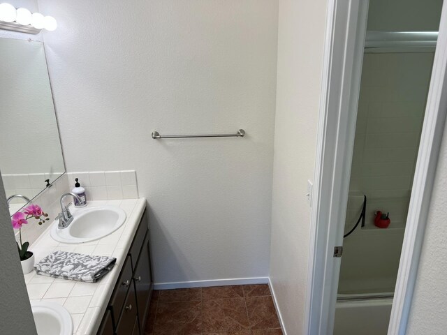 bathroom featuring tile patterned flooring and vanity