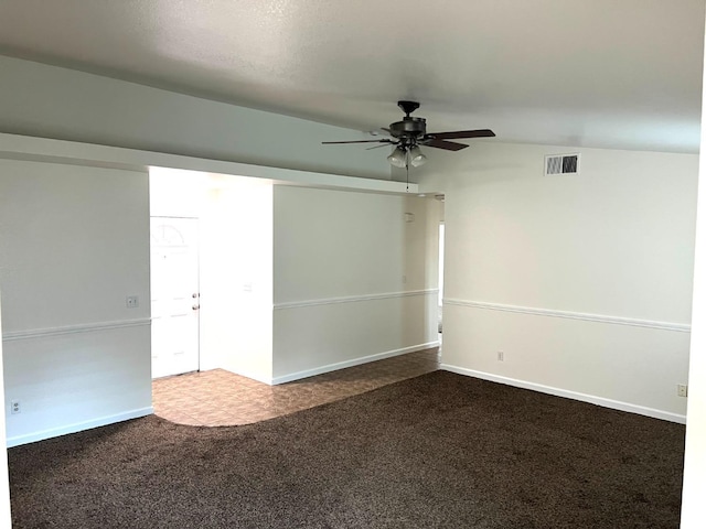 spare room with ceiling fan and carpet