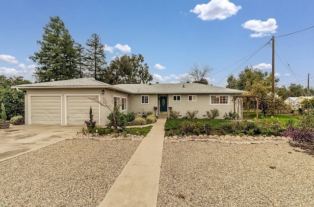 ranch-style home featuring a garage